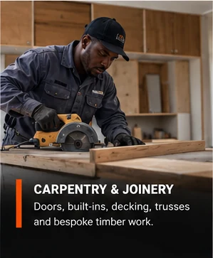 Carpenter planning timber in a workshop