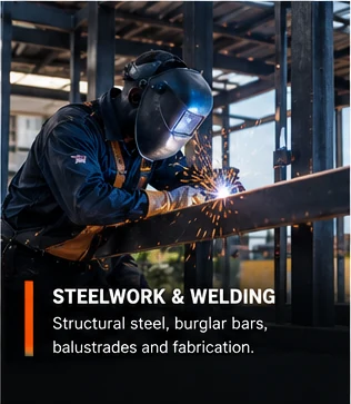 Welder working on structural steel with sparks flying