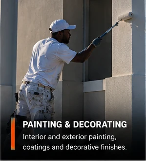 Painter rolling paint onto an exterior wall